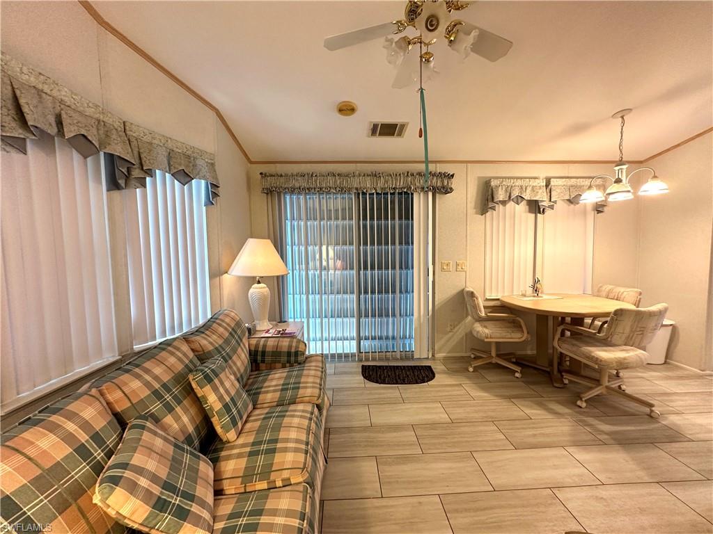 4540 Split Log Lane East Estero, FL 33928 - Photo 14 of 15 a bedroom with furniture and a window