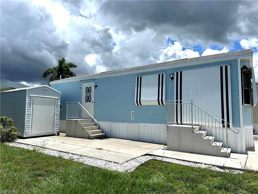 4540 Split Log Lane East Estero, FL 33928 - Photo 15 of 15 a front view of a house with a yard