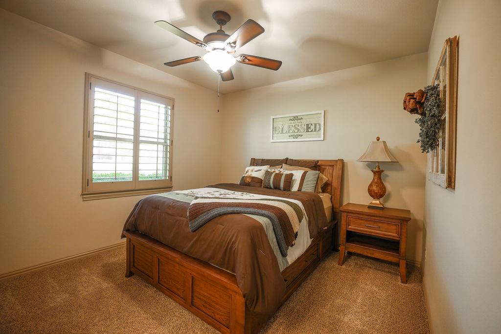 1387 Shadow Lakes Drive Wills Point, TX 75169 - Photo 18 of 30 2nd Bedroom with carpet floors, ceiling fan, and baseboards