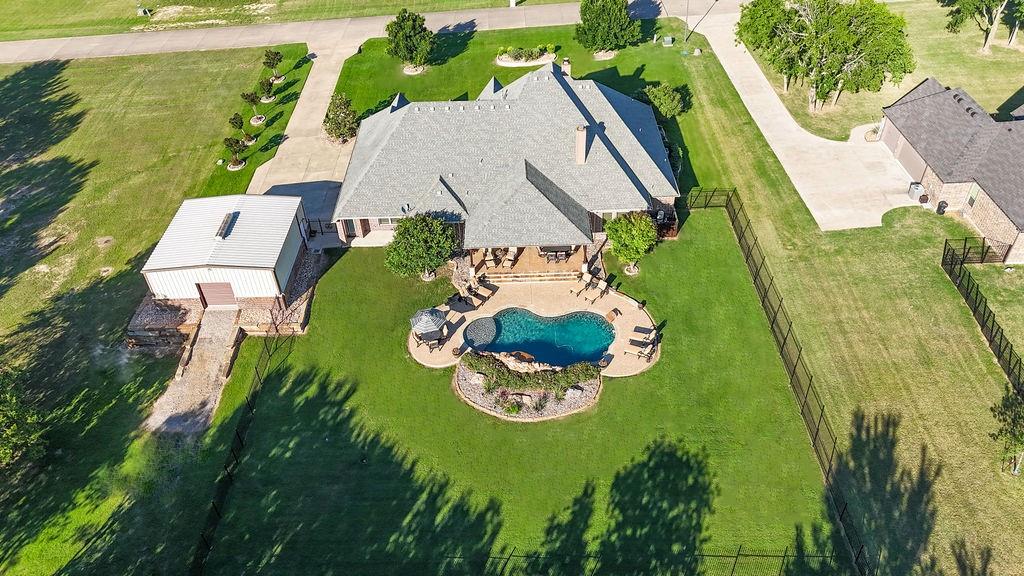 1387 Shadow Lakes Drive Wills Point, TX 75169 - Photo 2 of 30 Aerial view of property and surrounding area with a pool