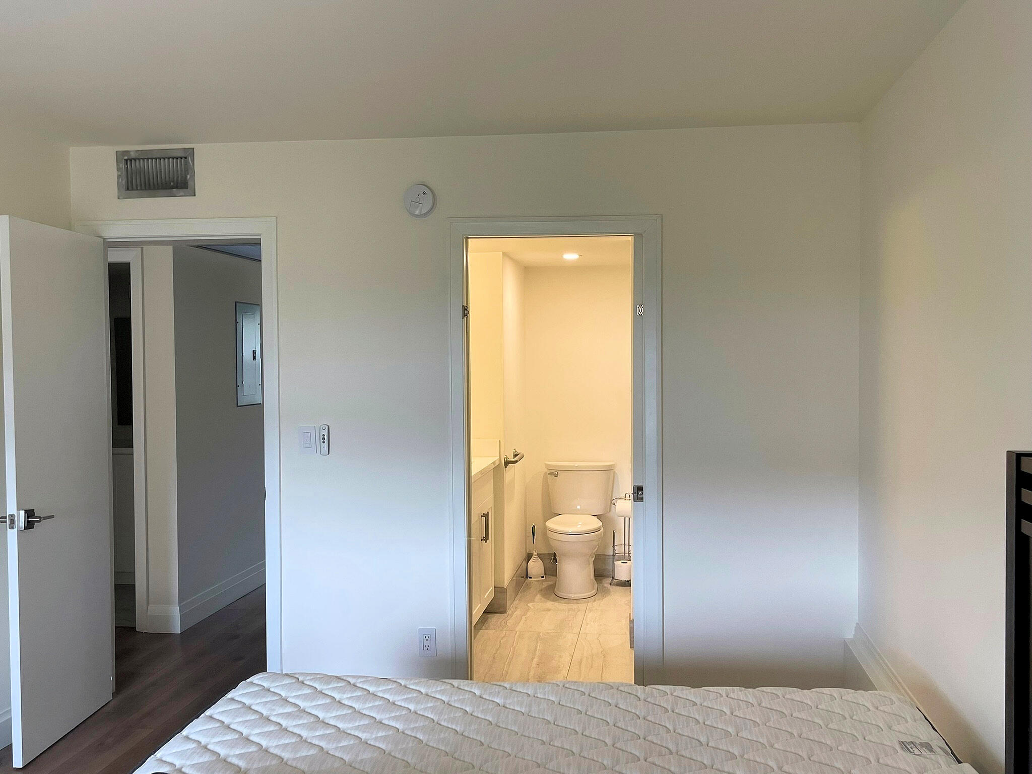 1030 Rexford B Boca Raton, FL 33434 - Photo 12 of 27 a bedroom with a bed and wooden floor