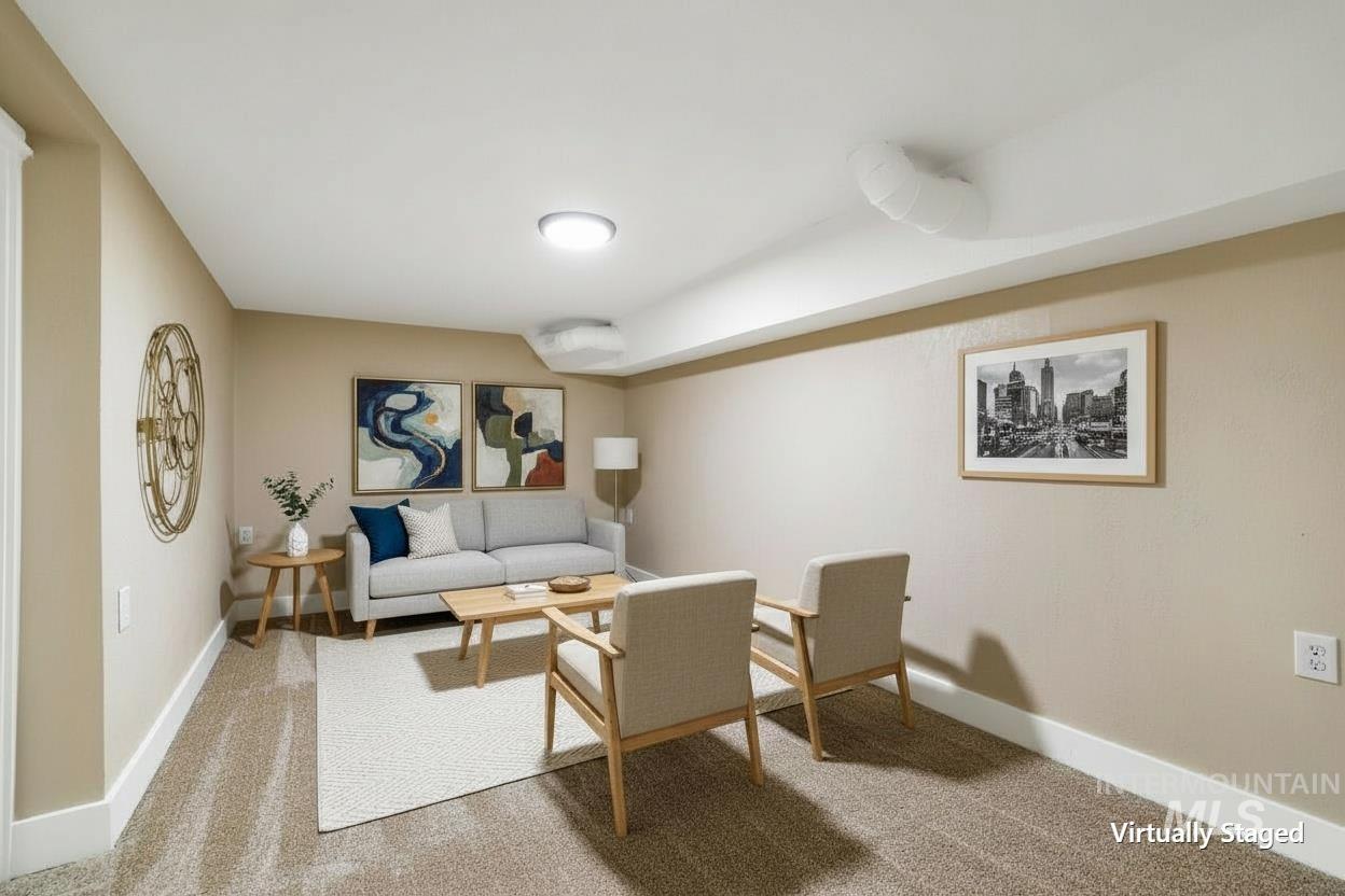 1226 Washington Street Gooding, ID 83330 - Photo 8 of 13 Living area featuring light carpet and baseboards