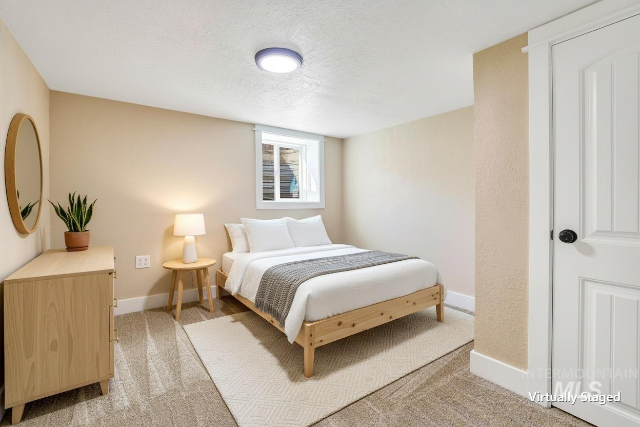 1226 Washington Street Gooding, ID 83330 - Photo 10 of 13 Bedroom with a textured ceiling and light carpet