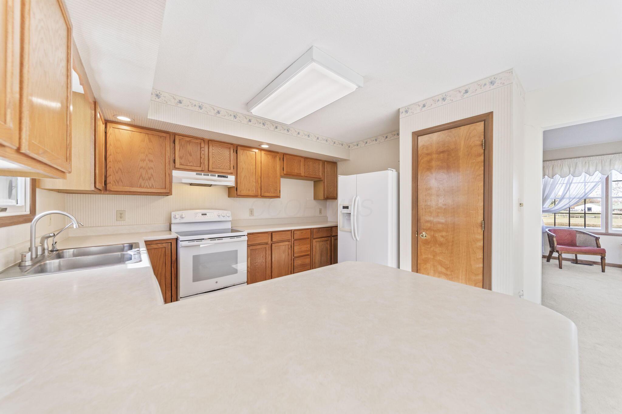 9791 Jug St Road Northwest Pataskala, OH 43062 - Photo 14 of 83 Light and airy kitchen.
