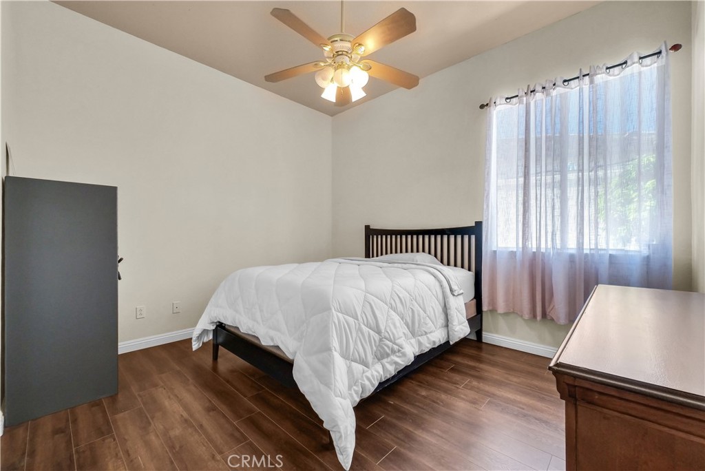 45407 Callesito Altar Temecula, CA 92592 - Photo 21 of 47 a bed sitting in a bedroom next to a window and a chandelier