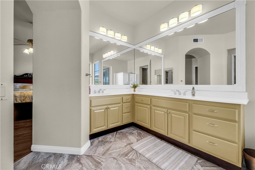 45407 Callesito Altar Temecula, CA 92592 - Photo 28 of 47 a spacious bathroom with a double vanity sink and a mirror