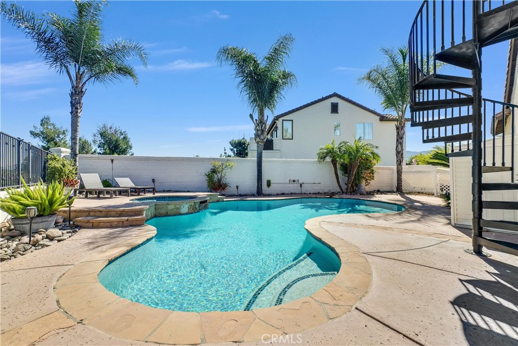 45407 Callesito Altar Temecula, CA 92592 - Photo 33 of 47 a view of a house with backyard sitting area and swimming pool
