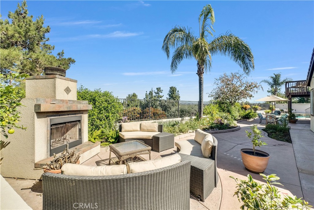 45407 Callesito Altar Temecula, CA 92592 - Photo 35 of 47 a view of a patio with couches table and chairs and potted plants