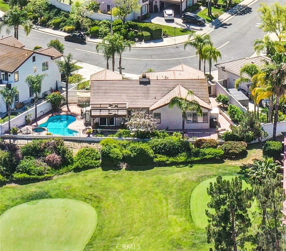 45407 Callesito Altar Temecula, CA 92592 - Photo 7 of 47 a aerial view of a house with swimming pool and a yard