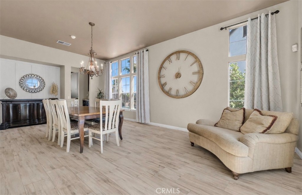 45407 Callesito Altar Temecula, CA 92592 - Photo 9 of 47 a living room with furniture a large window and wooden floor