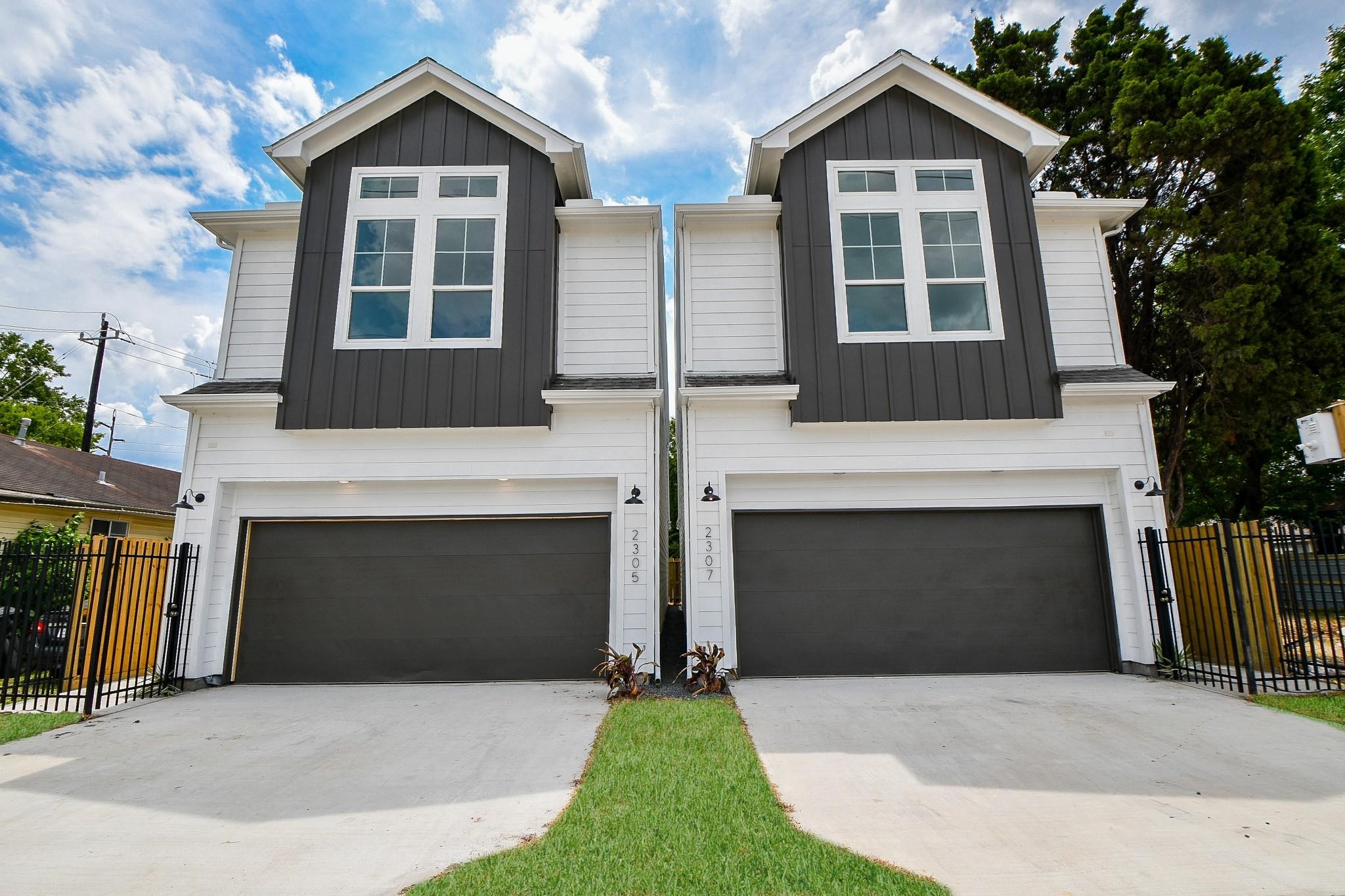 2305 Maury Street Houston, TX 77026 - Photo 1 of 19 a front view of a house with yard and parking