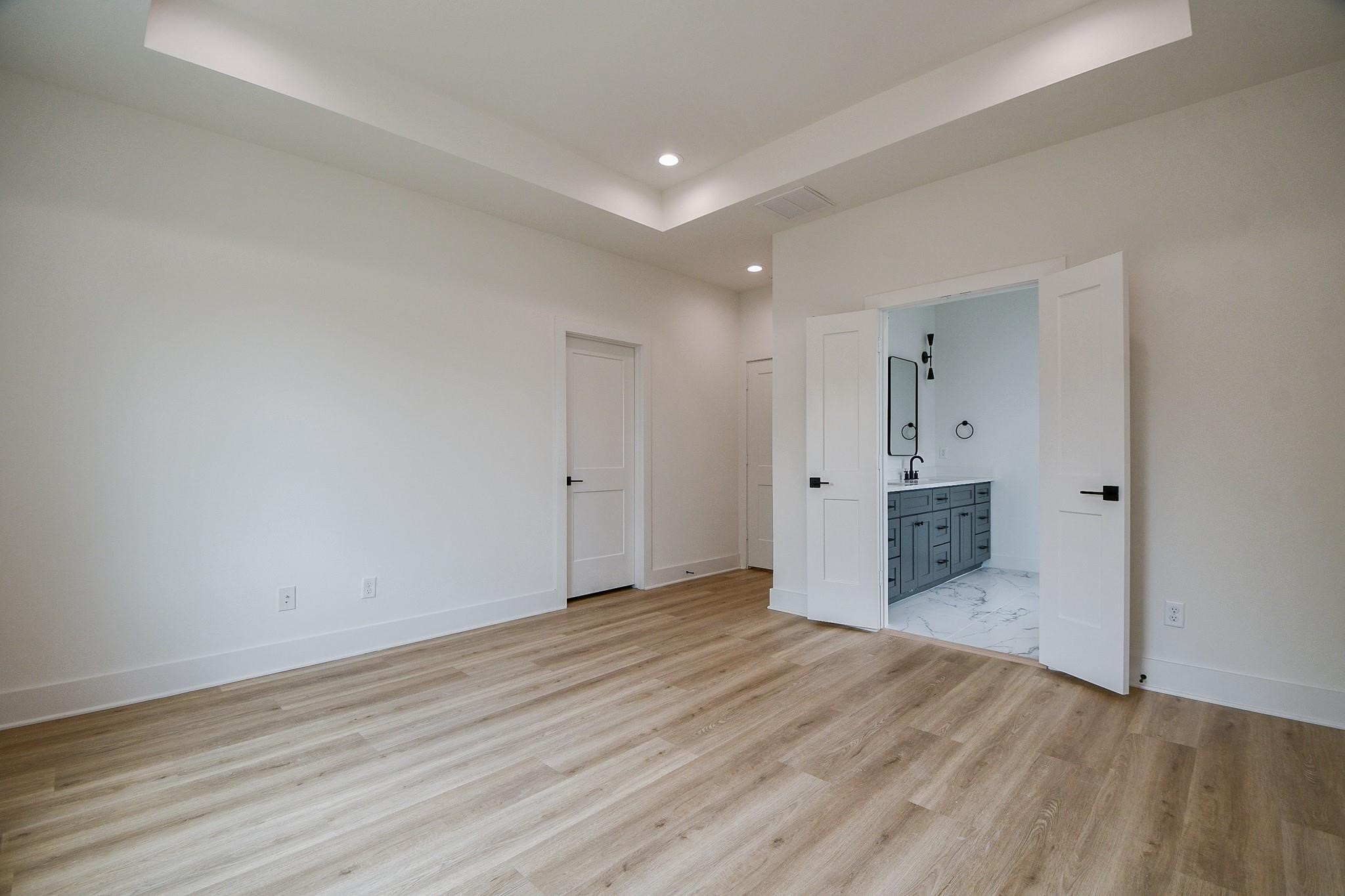 2305 Maury Street Houston, TX 77026 - Photo 11 of 19 a view of an empty room with wooden floor