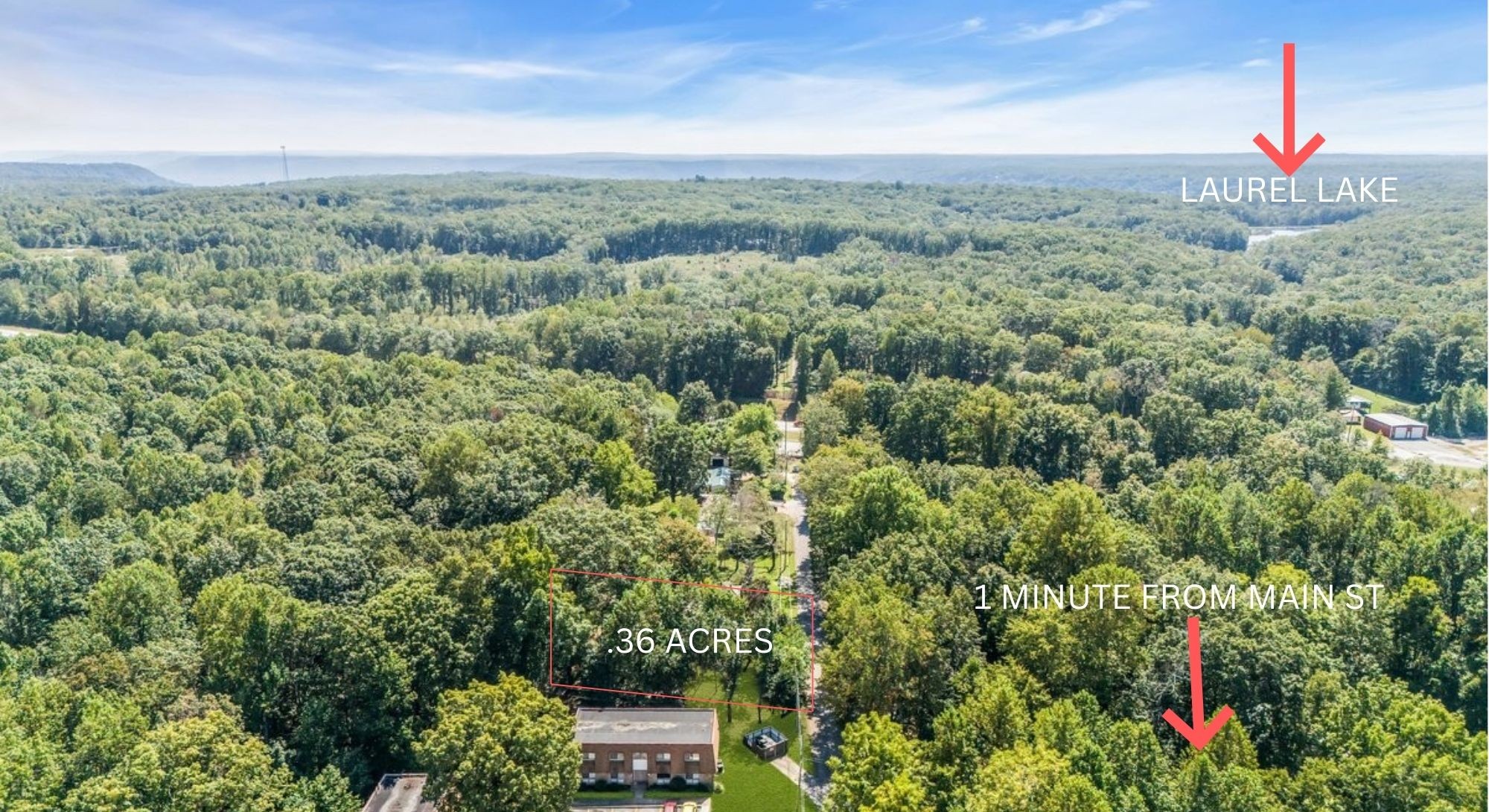 314 Spring Street Monteagle, TN 37356 - Photo 2 of 2 an aerial view of a houses with a lush green forest