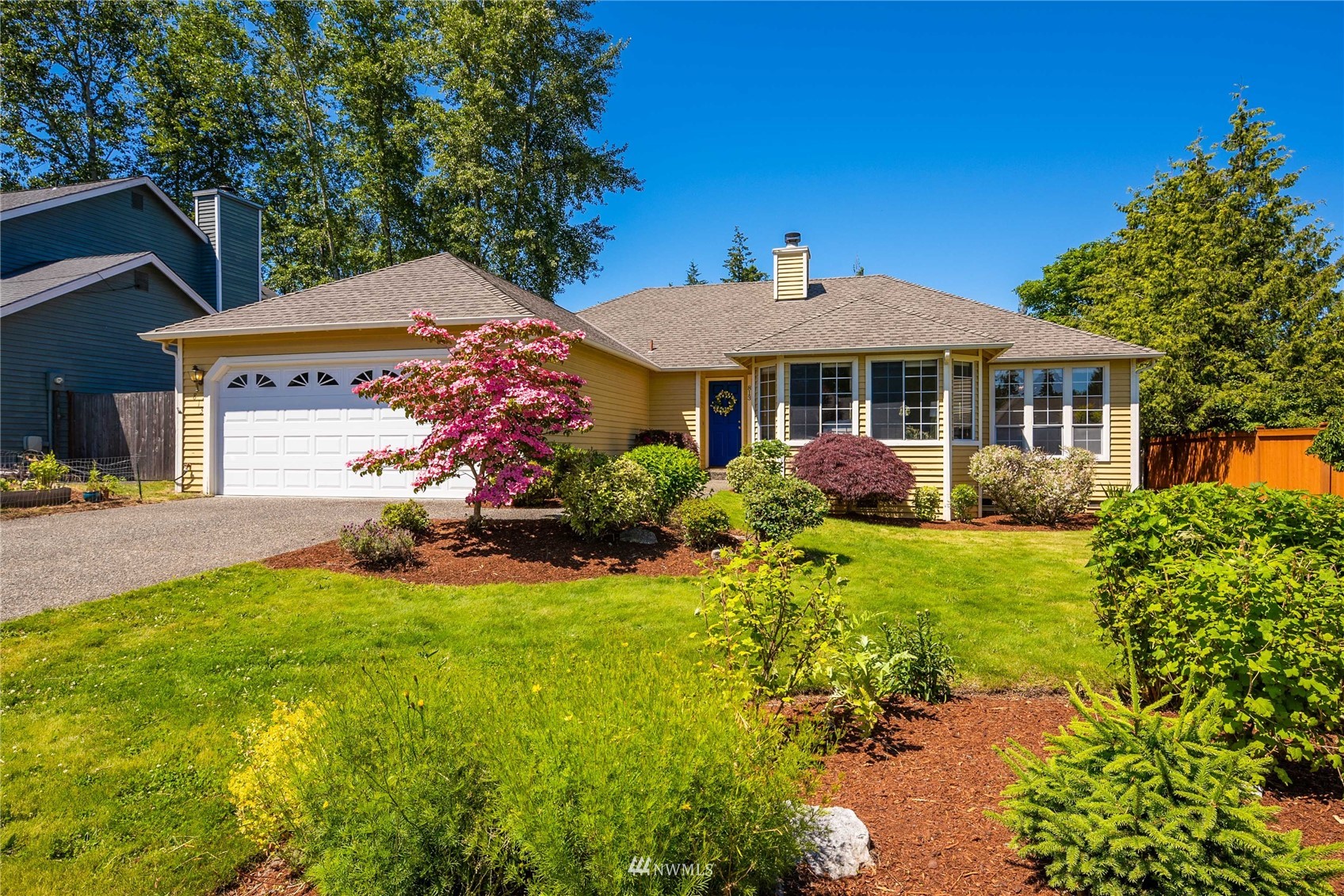 813 226th Street Southeast Bothell, WA 98021 - Photo 1 of 30 a front view of a house with garden