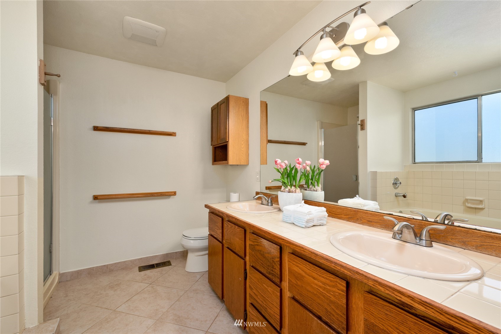 813 226th Street Southeast Bothell, WA 98021 - Photo 19 of 30 a bathroom with a sink a light fixture and a mirror