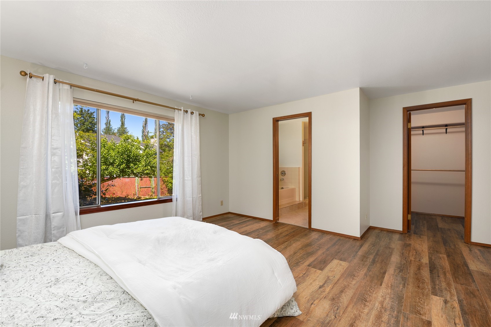 813 226th Street Southeast Bothell, WA 98021 - Photo 20 of 30 a bedroom with a bed and a large window