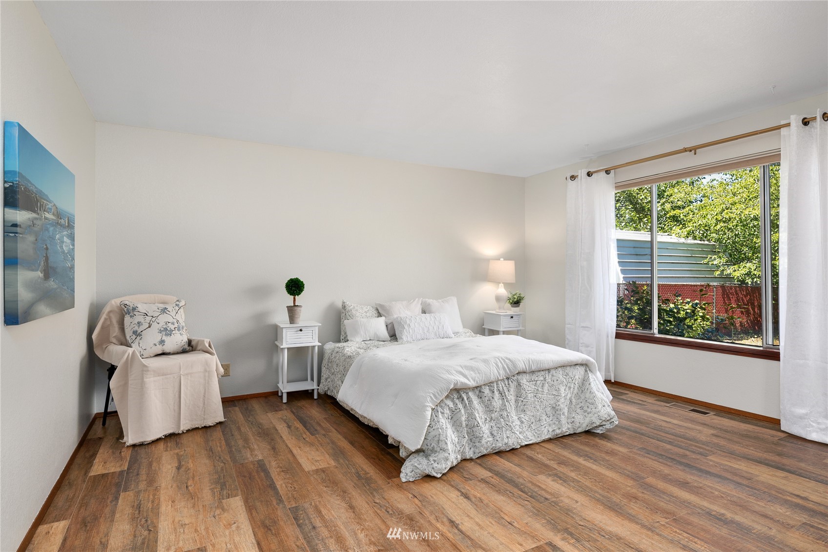 813 226th Street Southeast Bothell, WA 98021 - Photo 21 of 30 a bedroom with a bed and a large window
