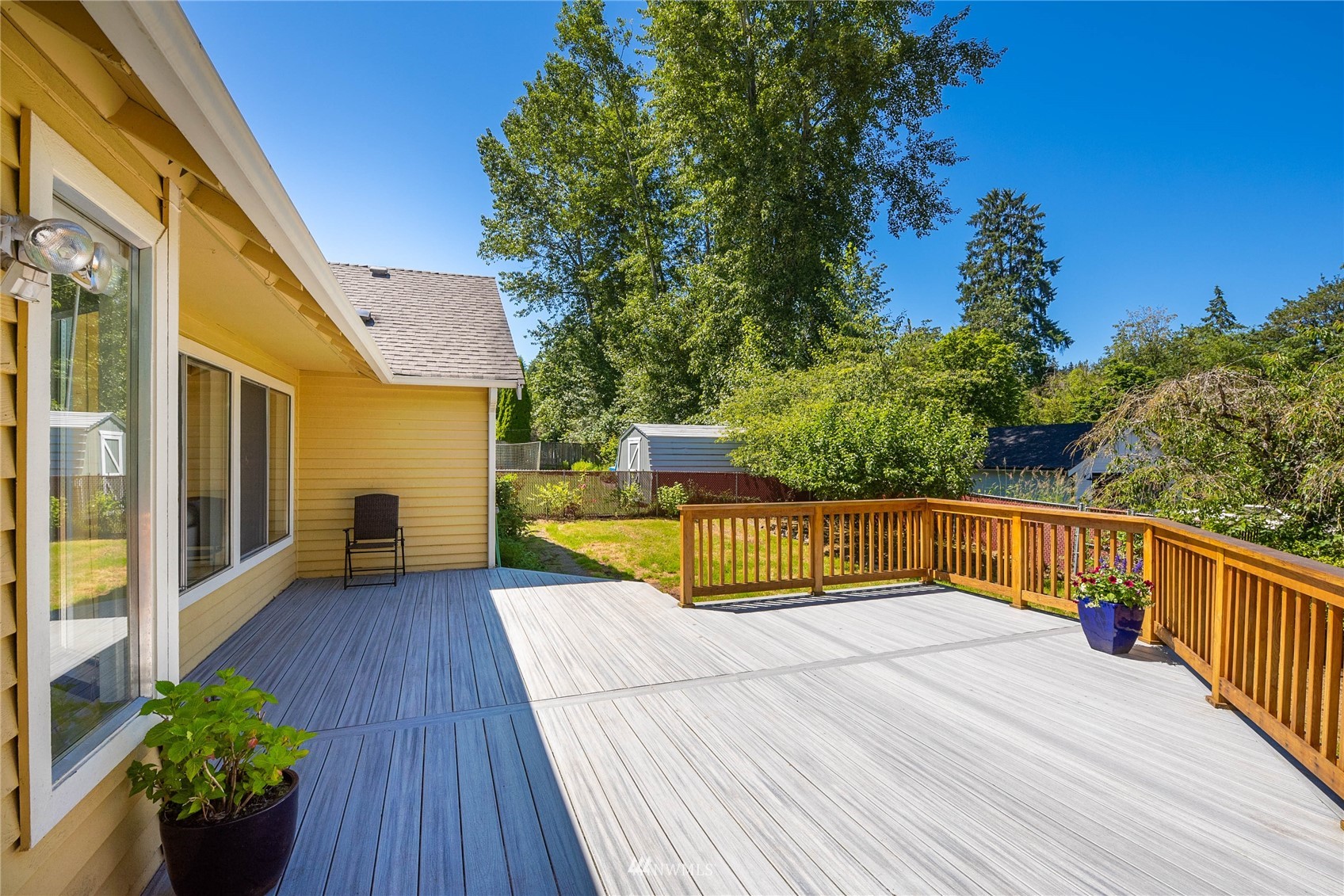 813 226th Street Southeast Bothell, WA 98021 - Photo 23 of 30 a view of a balcony with wooden floor and a potted plant