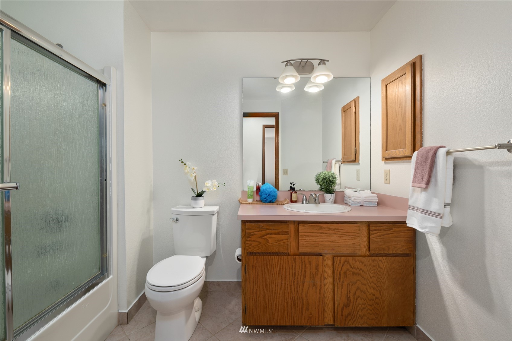 813 226th Street Southeast Bothell, WA 98021 - Photo 26 of 30 a bathroom with a sink a toilet and mirror