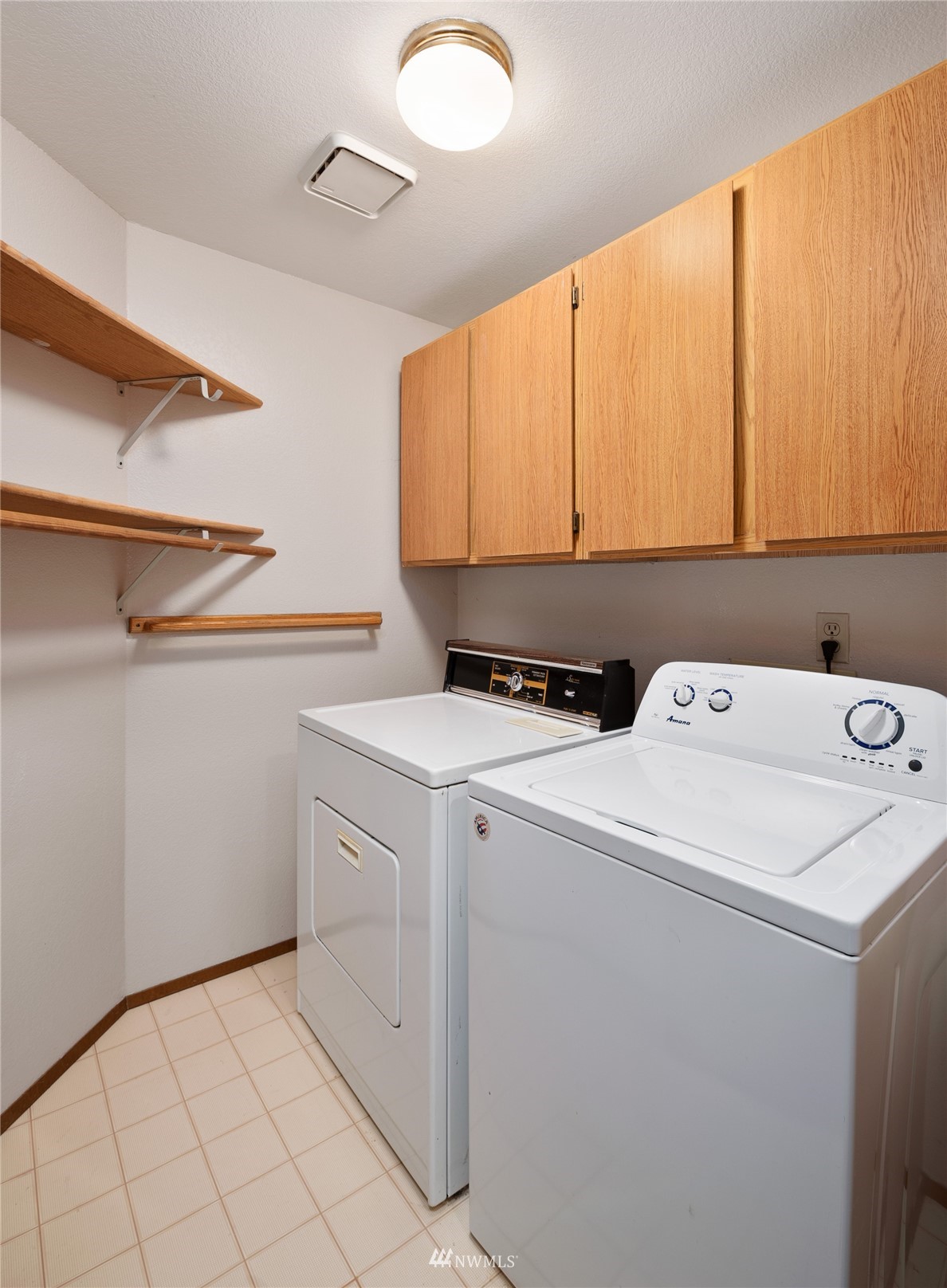 813 226th Street Southeast Bothell, WA 98021 - Photo 27 of 30 a view of storage and utility room with washer and dryer