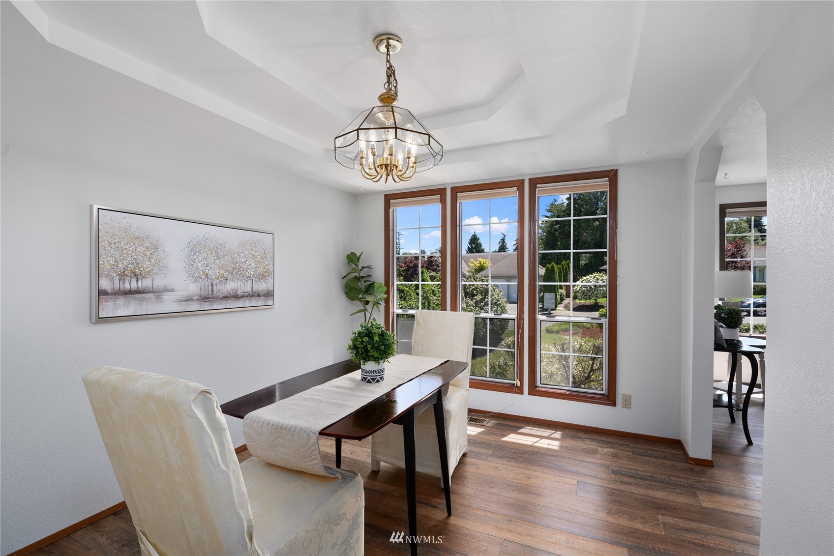 813 226th Street Southeast Bothell, WA 98021 - Photo 8 of 30 a view of a dining room with furniture wooden floor and chandelier