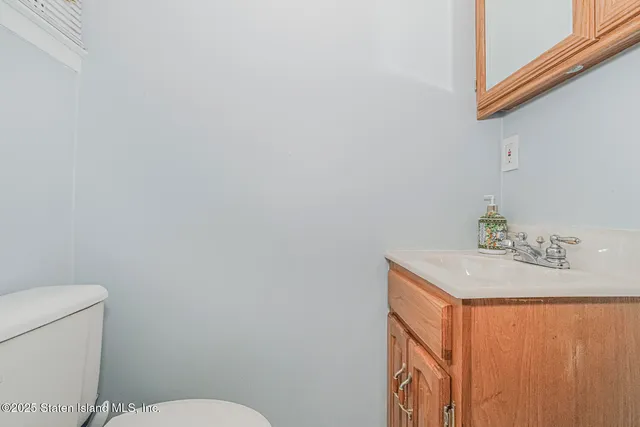 a view of staircase with wooden floor and a potted plant