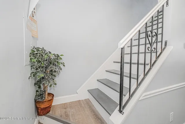 a bedroom with a bed and a table