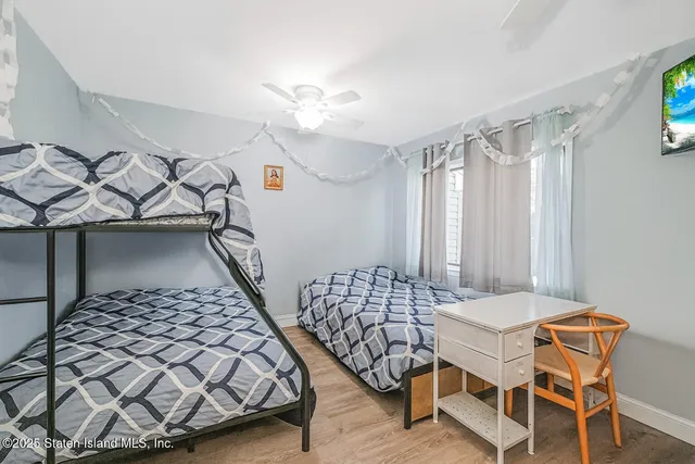 a bedroom with furniture and a chandelier
