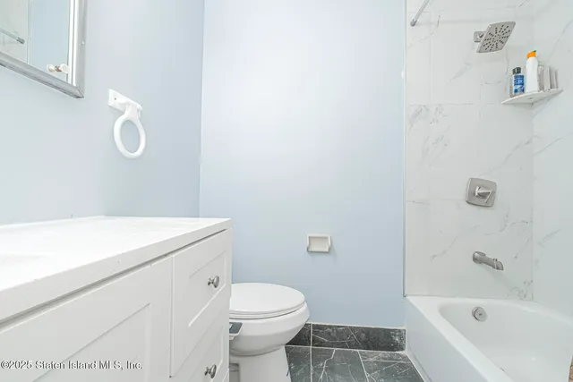 a house view with a seating space and garden