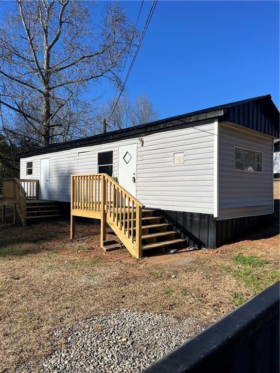 338 Georgianna Street Jasper, GA 30143 - Photo 1 of 8 a view of a backyard with stairs
