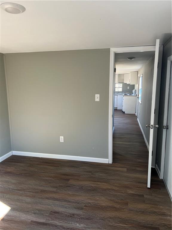 338 Georgianna Street Jasper, GA 30143 - Photo 6 of 8 a view of a room with wooden floor