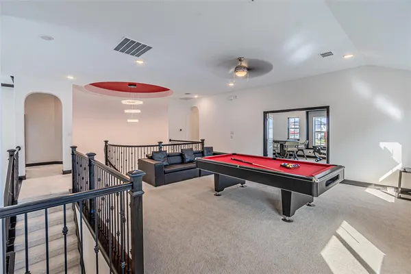 a kitchen with stainless steel appliances kitchen island granite countertop a refrigerator and microwave