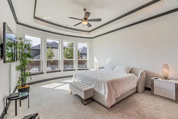 a room with granite countertop a sink and a washing machine