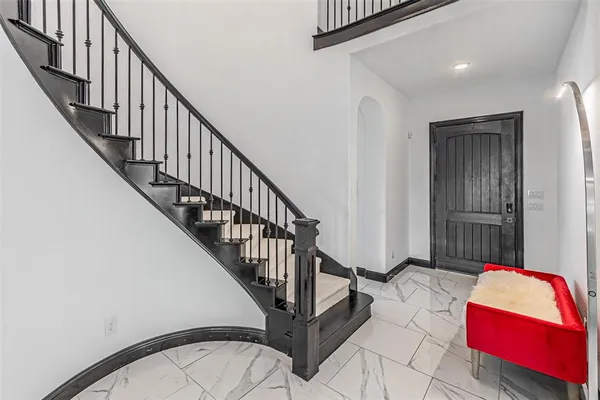 an entryway with a fireplace and window
