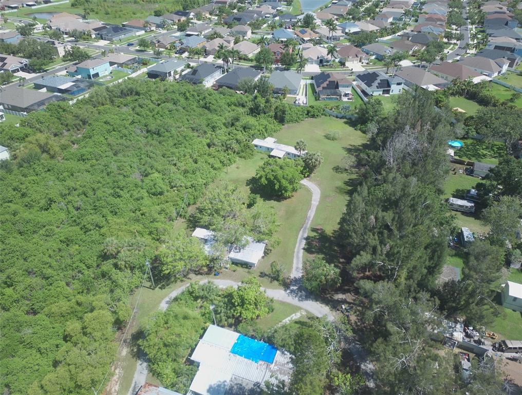 1603 West Shell Point Road Ruskin, FL 33570 - Photo 15 of 18 an aerial view of a residential houses with outdoor space and trees
