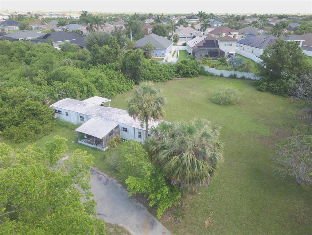 1603 West Shell Point Road Ruskin, FL 33570 - Photo 3 of 18 an aerial view of residential houses with outdoor space and river
