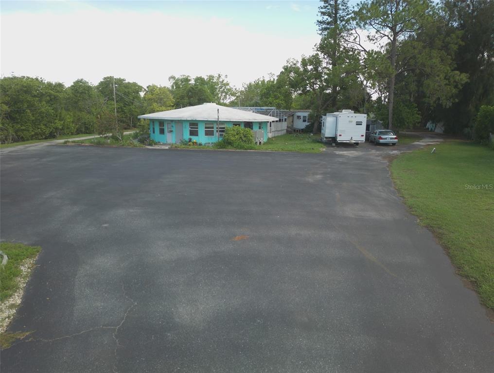 1603 West Shell Point Road Ruskin, FL 33570 - Photo 5 of 18 a view of a house with a yard and sitting area