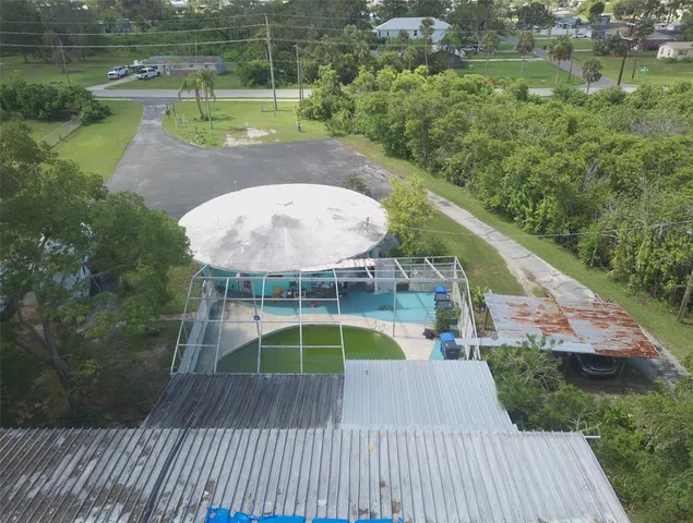 an aerial view of a house with a swimming pool