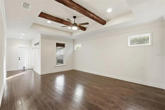 a view of a kitchen with wooden floor and a kitchen