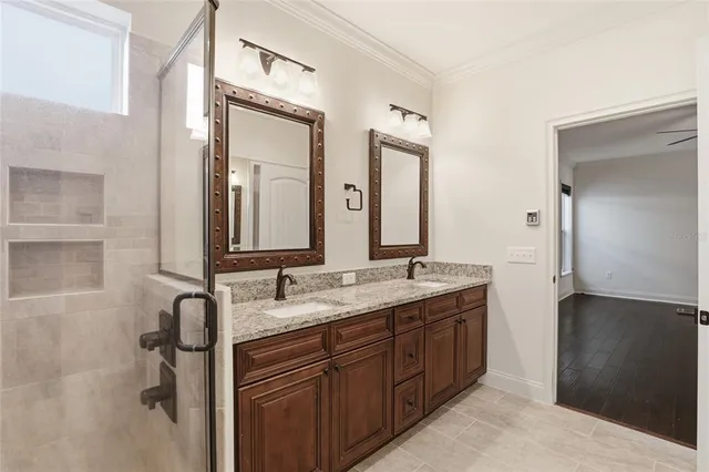 an empty room with wooden floor and white walls