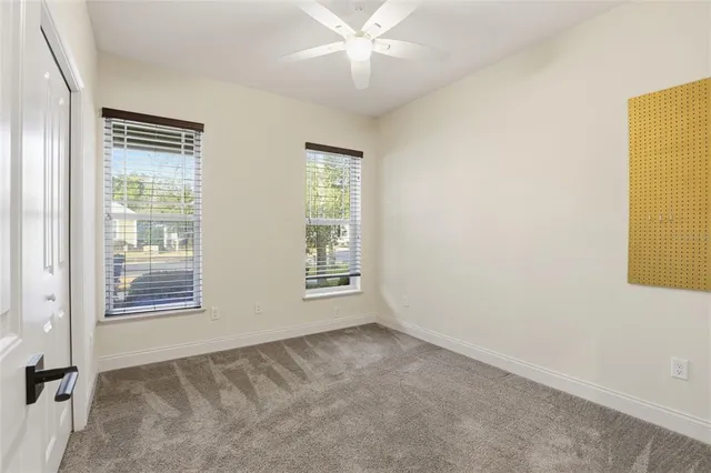 a view of an empty room with a bathroom