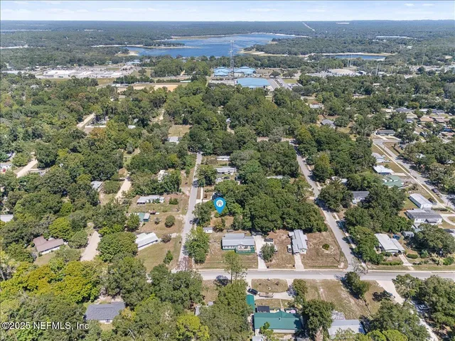 an aerial view of residential house and green space