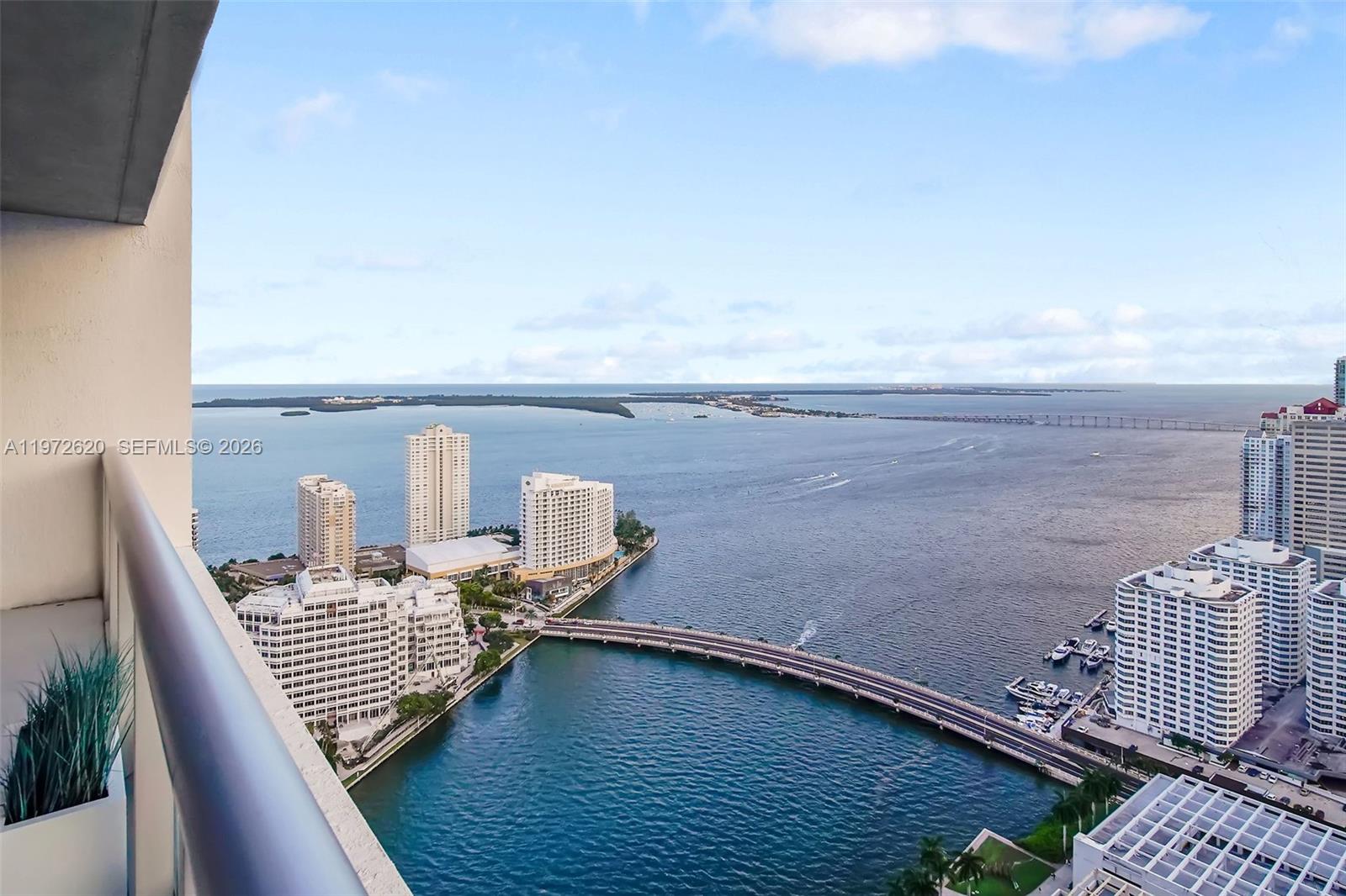 495 Brickell Avenue, Unit 4209 Miami, FL 33131 - Photo 13 of 37 a view of roof deck with two chair and wooden floor