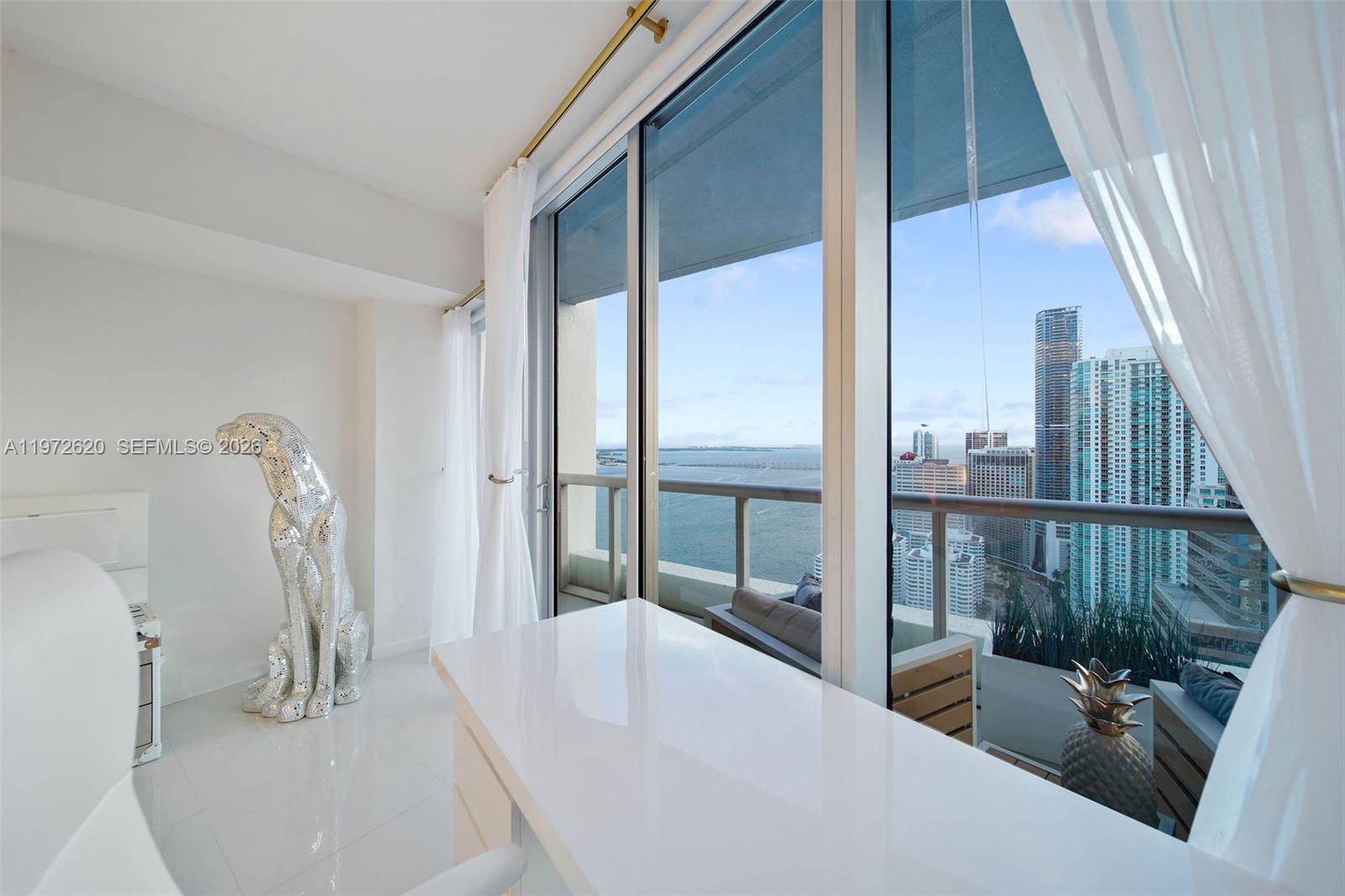 495 Brickell Avenue, Unit 4209 Miami, FL 33131 - Photo 19 of 37 a view of a living room and a balcony