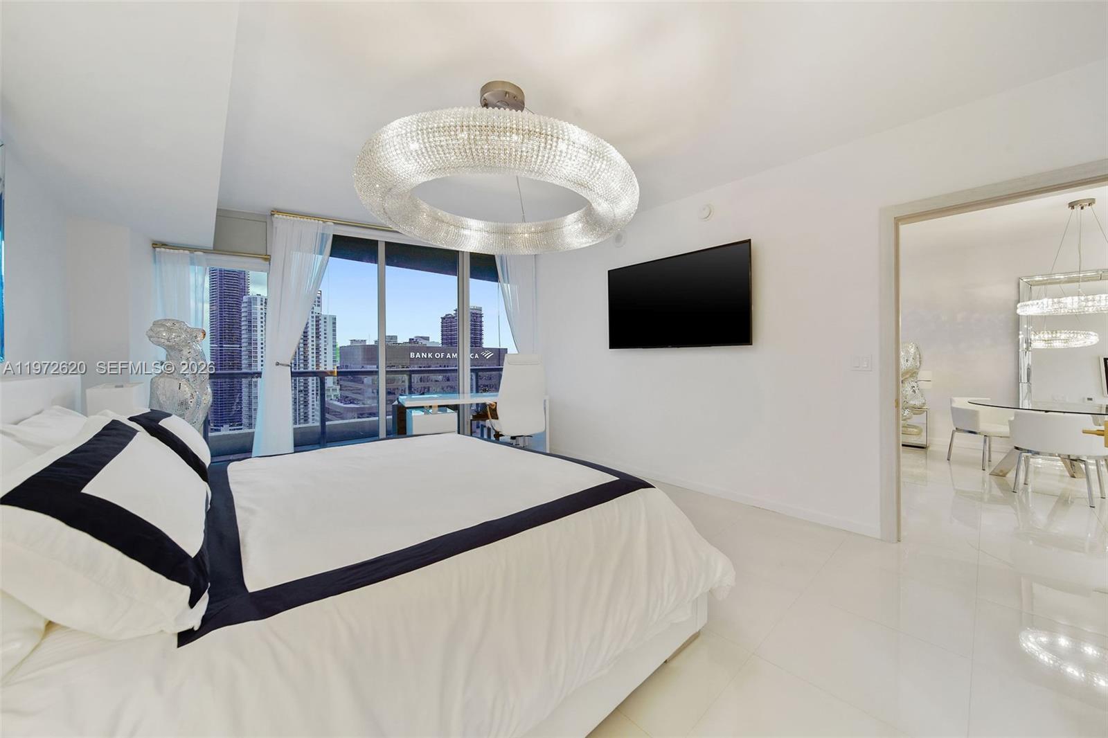 495 Brickell Avenue, Unit 4209 Miami, FL 33131 - Photo 21 of 37 a living room with furniture and a flat screen tv