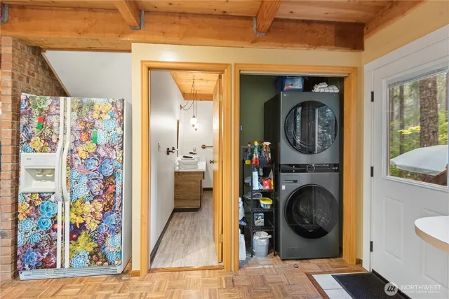 a view of a bedroom with washer and dryer