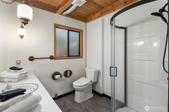a bathroom with a toilet sink and mirror