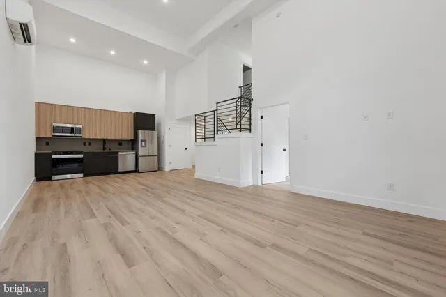 a view of kitchen with furniture and wooden floor
