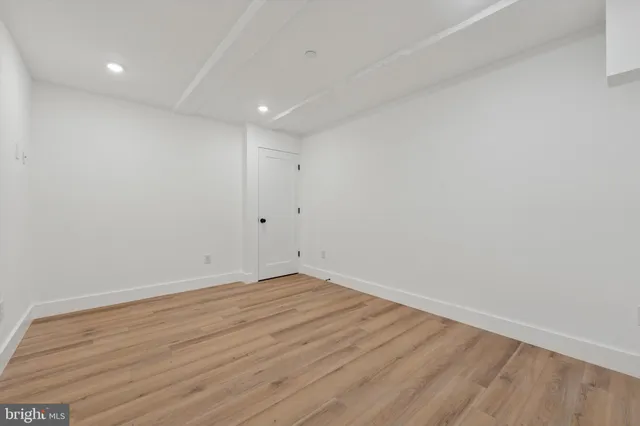 a view of room with wooden floor