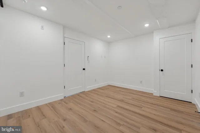 a view of room with wooden floor